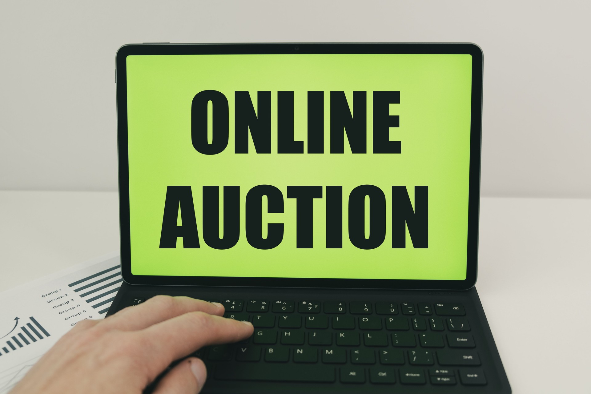 the concept of an online auction with text on a laptop screen